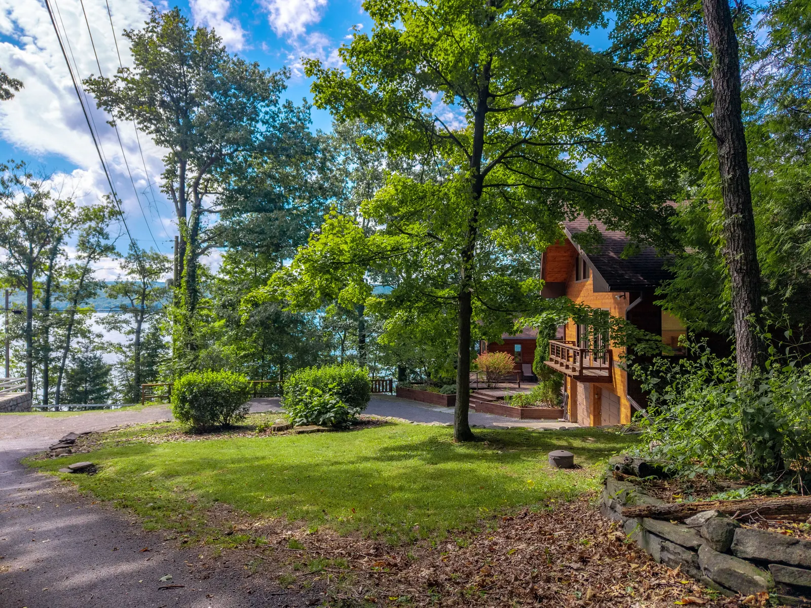 Drone view of the waterfront and forested hillside